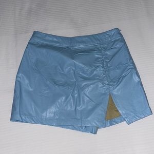 Baby blue leather skirt .